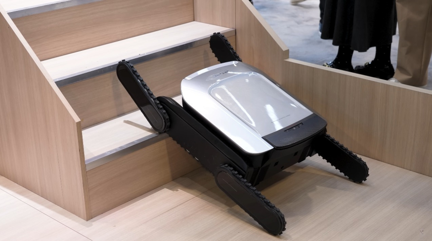 Afbeelding: Robotstofzuigerconcept met uitschuifbare “benen” die een trap beklimt